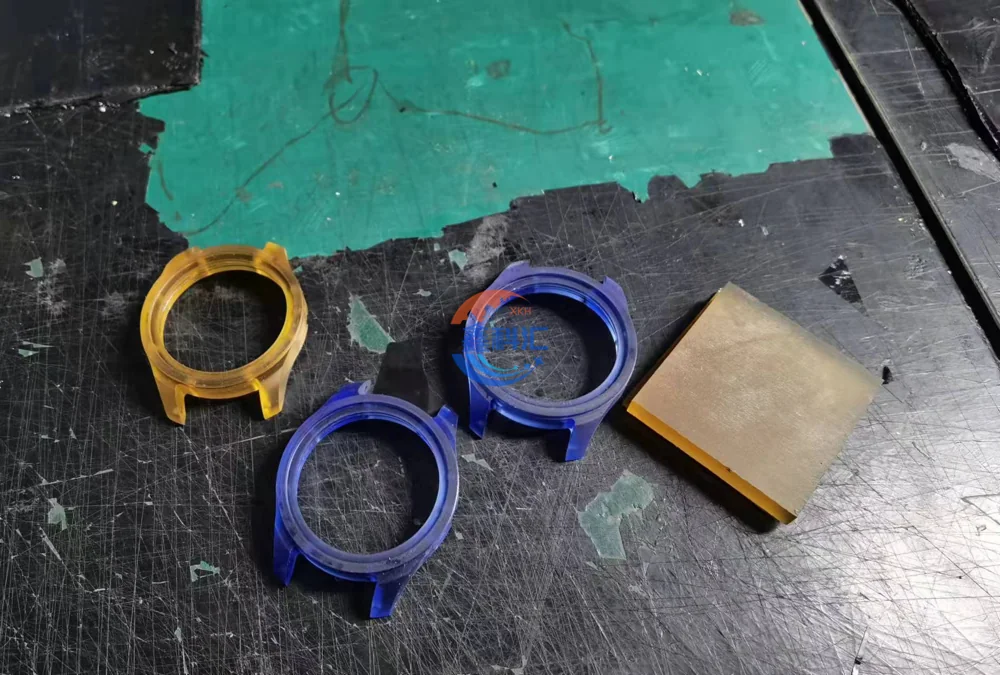 Yellow and blue colored sapphire watch case components in a production setting